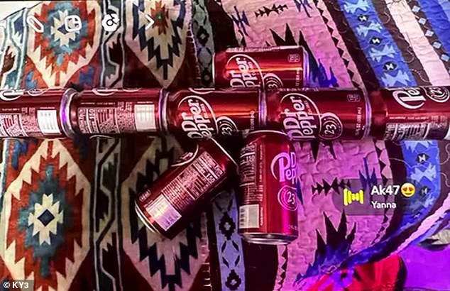 A teenage student from a school in Missouri has been suspended after posting a 'threatening' photo online of a set of Dr. Pepper soda cans in the shape of a high-powered rifle