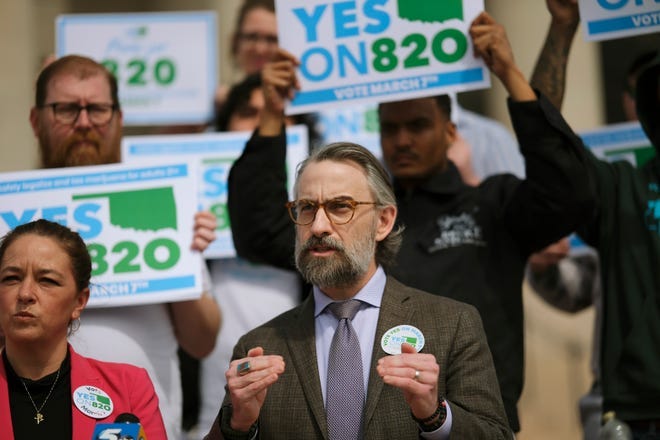 Michelle Tilley, left, and Ryan Kiesel address the media for Yes on 820 during a rally on the south plaza of the Capitol Monday, March 6, 2023