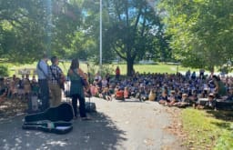 students seated outdoors for REP