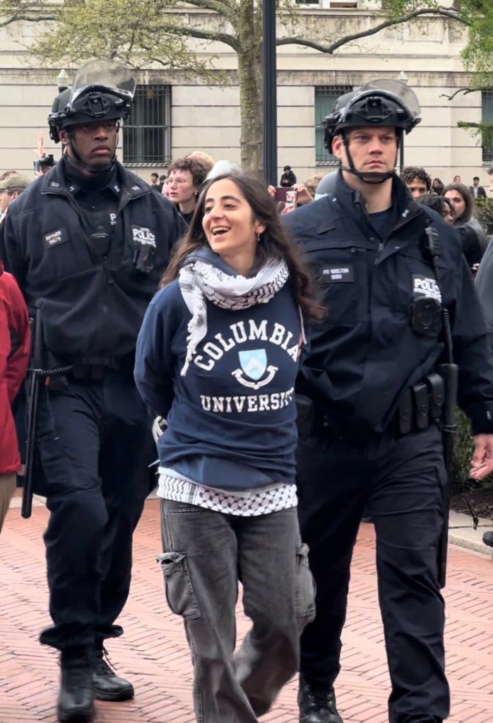 Maryam Alwan us detained by officers while attending a protest at Columbia University in NYC.