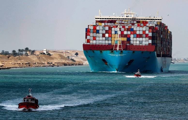 A shipping container passes through the Suez Canal in Suez, Egypt February 15, 2022. REUTERS/Mohamed Abd El Ghany
