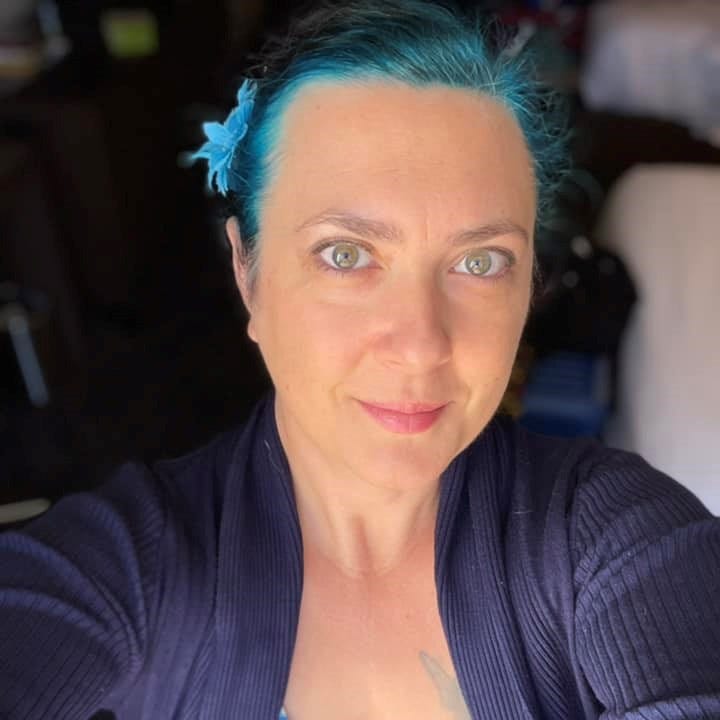 image of a woman with blue hair. Author Shannon Lawrence