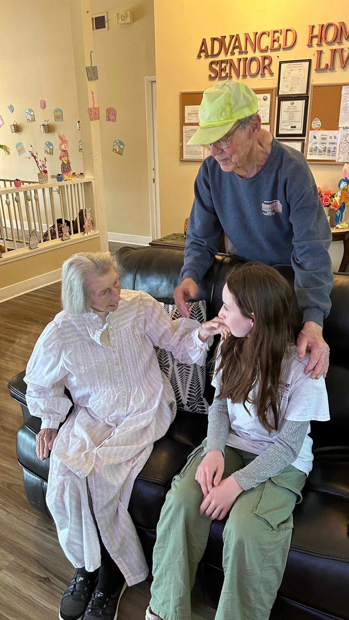 May be an image of 3 people, people smiling and hospital