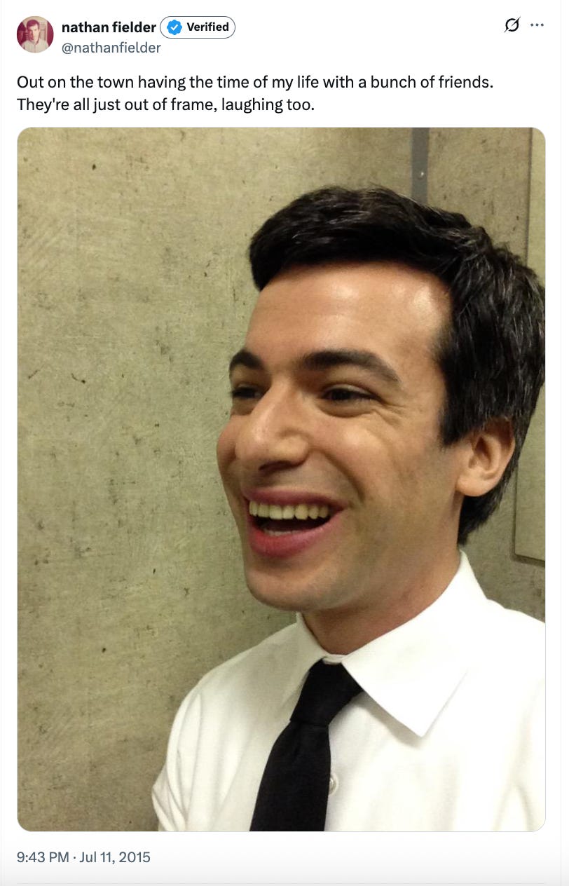 nathan fielder tweet reading Out on the town having the time of my life with a bunch of friends. They're all just out of frame, laughing too., image: fielder laughing by himself against a beige background
