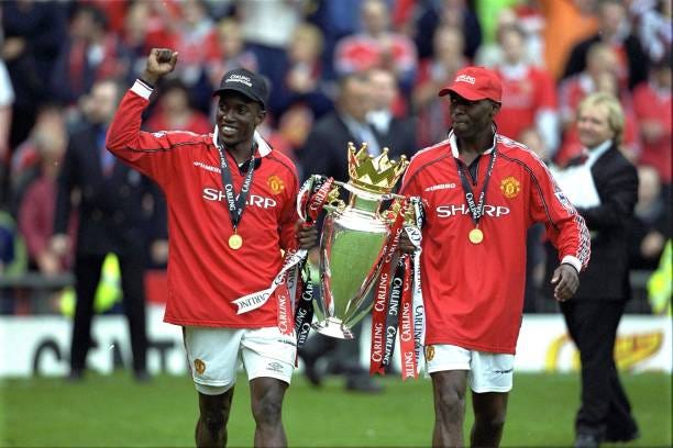 Dwight Yorke and Andy Cole celebrate after the FA Carling Premiership match between Manchester United v Tottenham Hotspur at Old Trafford on May 16,...