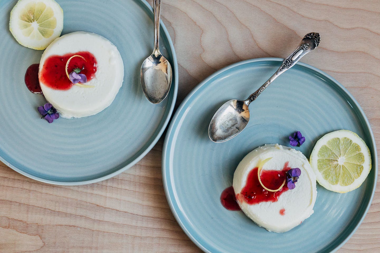 Two servings of panna cotta on plates