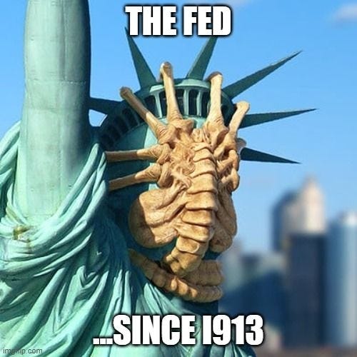 alien face gripper on the statue of liberty captioned The Fed since 1913