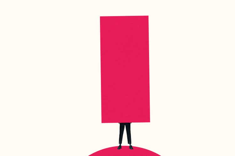 Low section of woman carrying large pink column