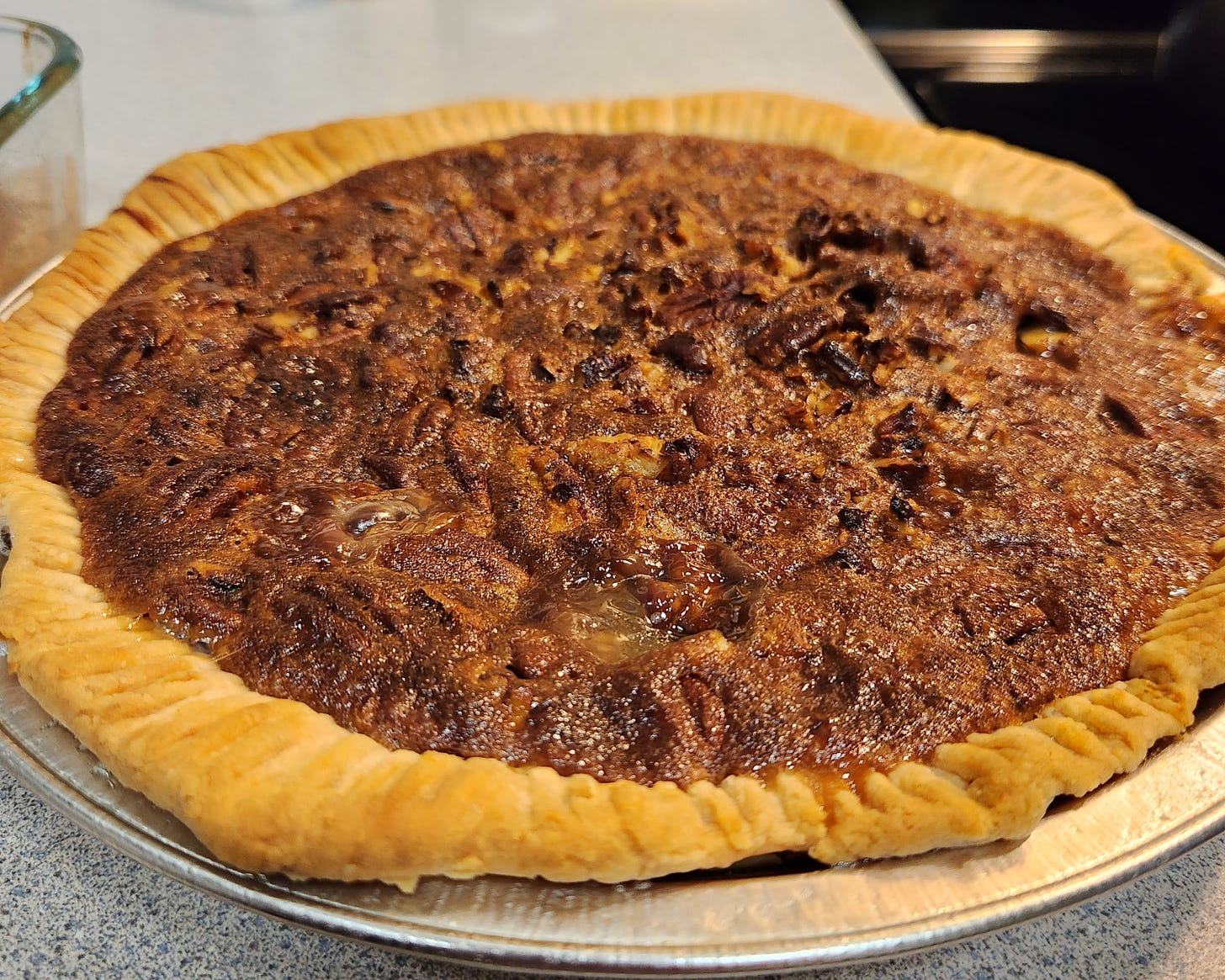 homemade pecan pie sitting on a counter