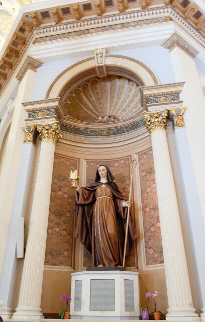 New Saint Clare Statue Holding a Gilded Monstrance Carved to Resemble the Cathedral