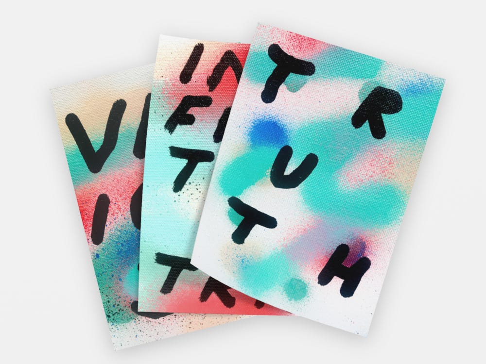 Stack of colorful paintings with hand drawn words. Text reads "Truth"