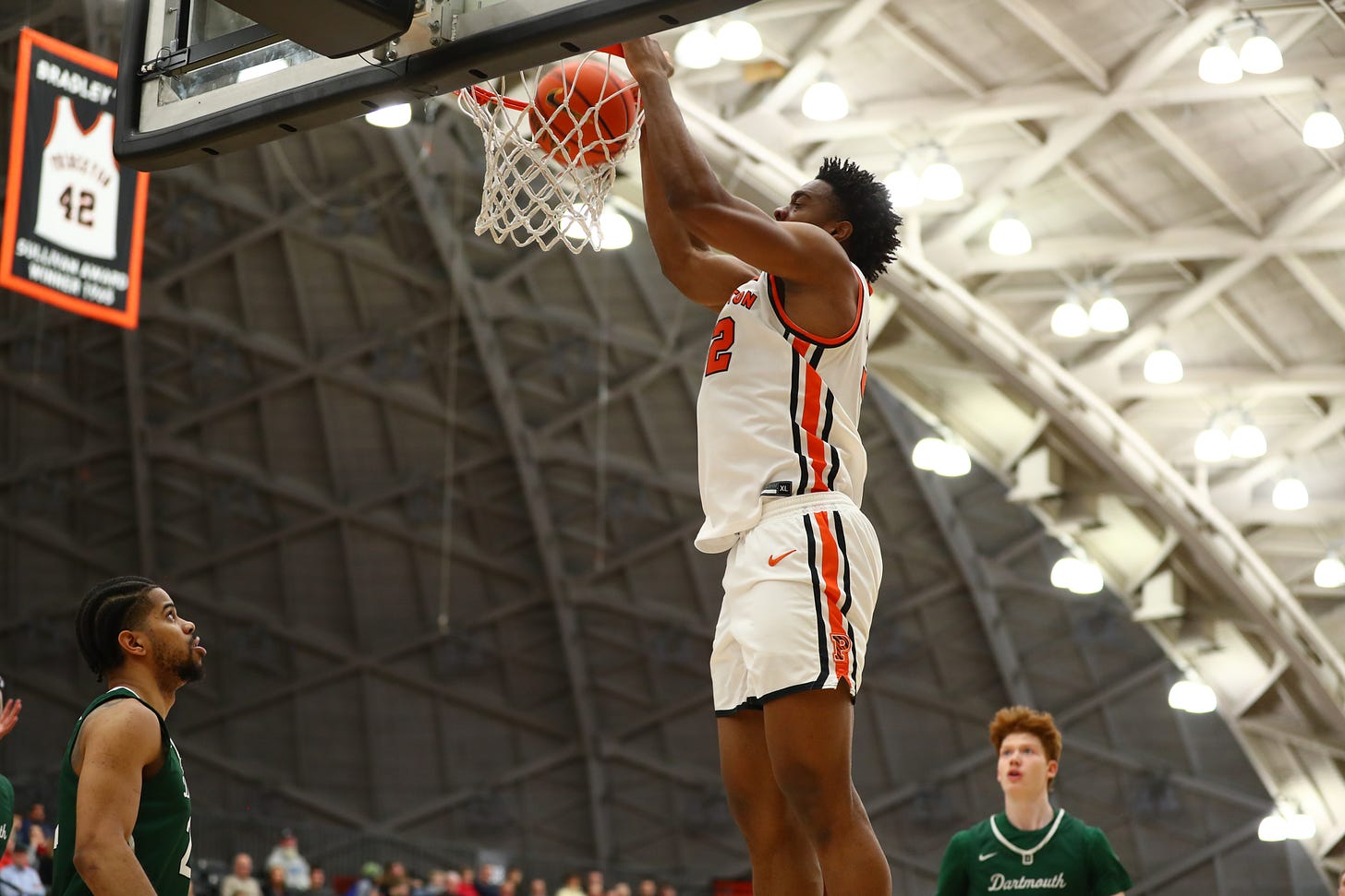 Keeshawn Kellman dunks during a home game against Dartmouth on Jan. 21, 2023. (Photo by Larry Levanti / courtesy of Princeton athletics)