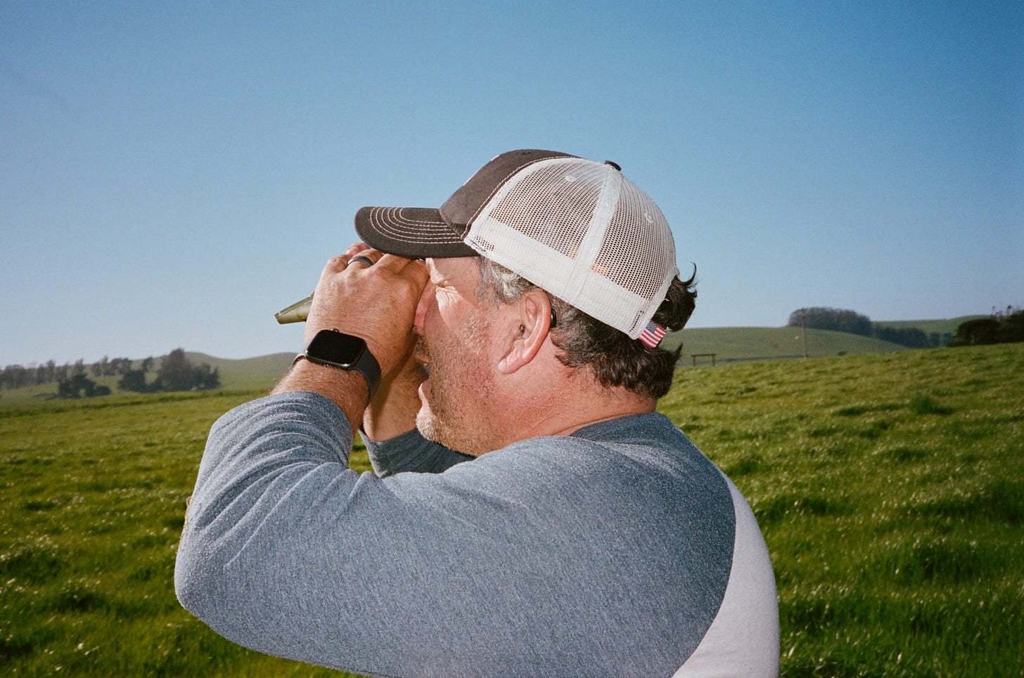 Loren Poncia of Stemple Creek Ranch uses a refractometer to check the sugar levels in his grass