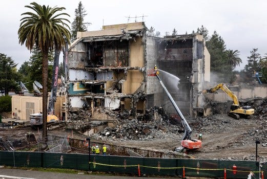 Demolition crews tear down the Flint Center for the Performing Arts, Tuesday, Dec. 17, 2024 at De Anza College in Cupertino, Calif. (Karl Mondon/Bay Area News Group)
