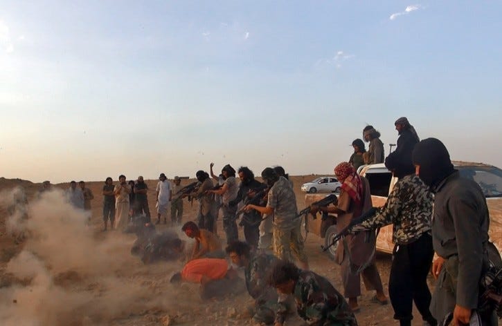 This undated image posted by the Raqqa Media Center of the Islamic State group, a Syrian opposition group, on Wednesday, Aug. 27, 2014, which has been verified and is consistent with other AP reporting, shows masked gunmen of the Islamic State group shooting seven men kneeling on the ground in front of them, in the aftermath of the group's takeover of the Tabqa air base in Raqqa province, Syria.  (AP Photo/ Raqqa Media Center of the Islamic State group)