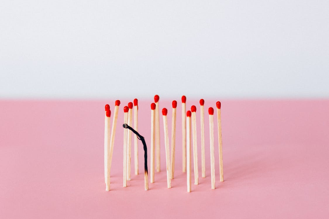 Free Matchsticks on Pink Surface Stock Photo