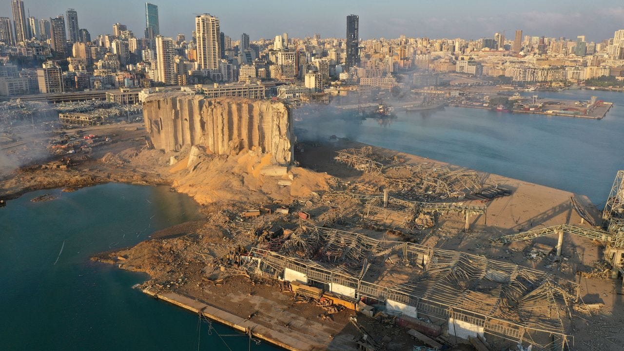Satellite images of Beirut explosion show massive crater at port | CNN