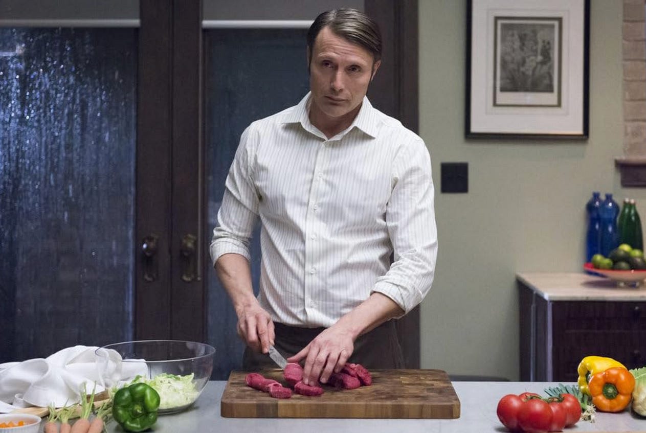 Picture of Hannibal Lecter cutting up unspecified meat / NBC