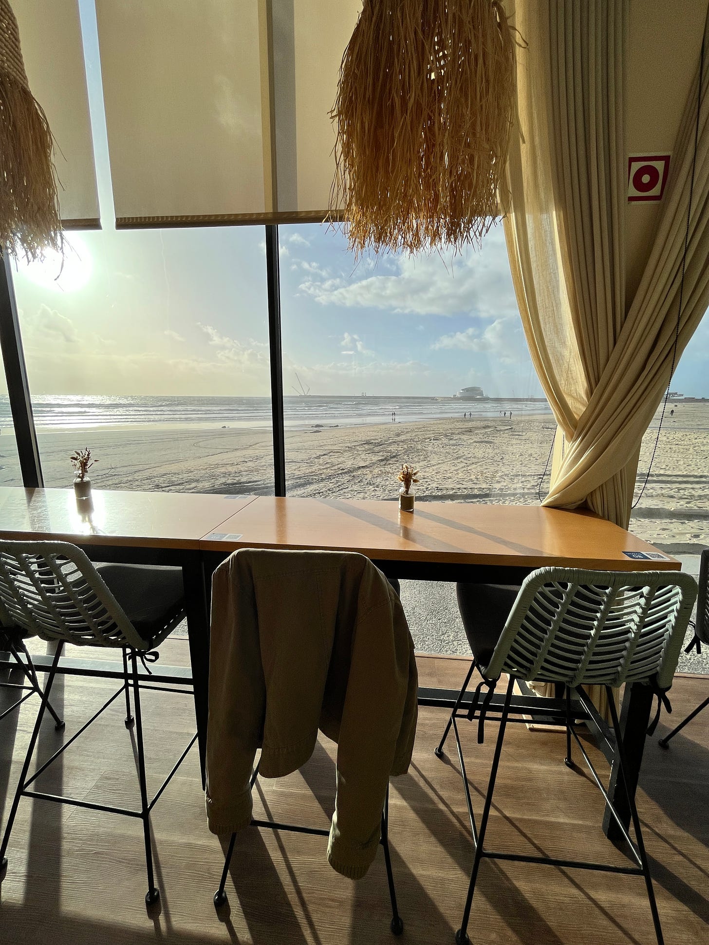 image: a long bench table overlooking the ocean view in Matosinhos Beach, Porto