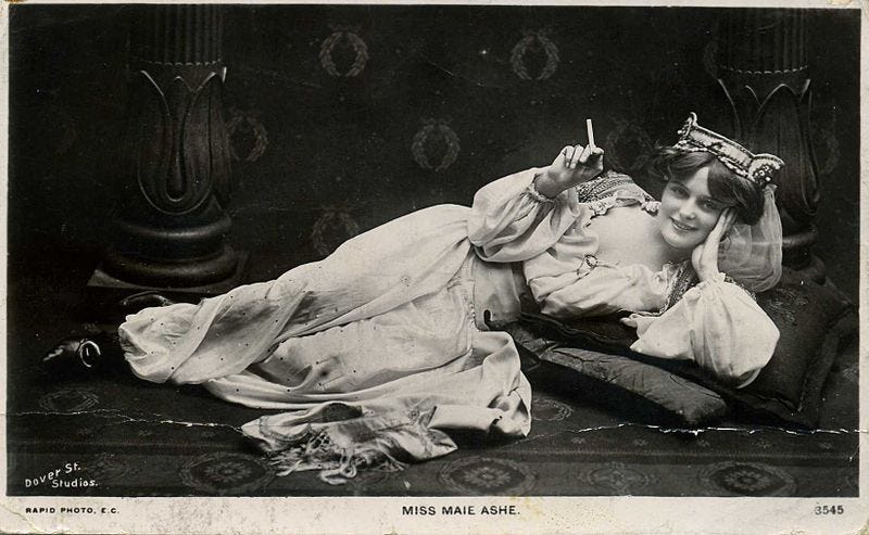 File:Miss Maie Ashe, actress, reclining, smoking a cigarette (postcard).jpg