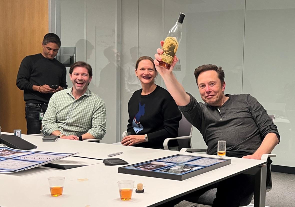 Musk and his lawyers celebrate the closing of the Twitter deal with a bottle of bourbon