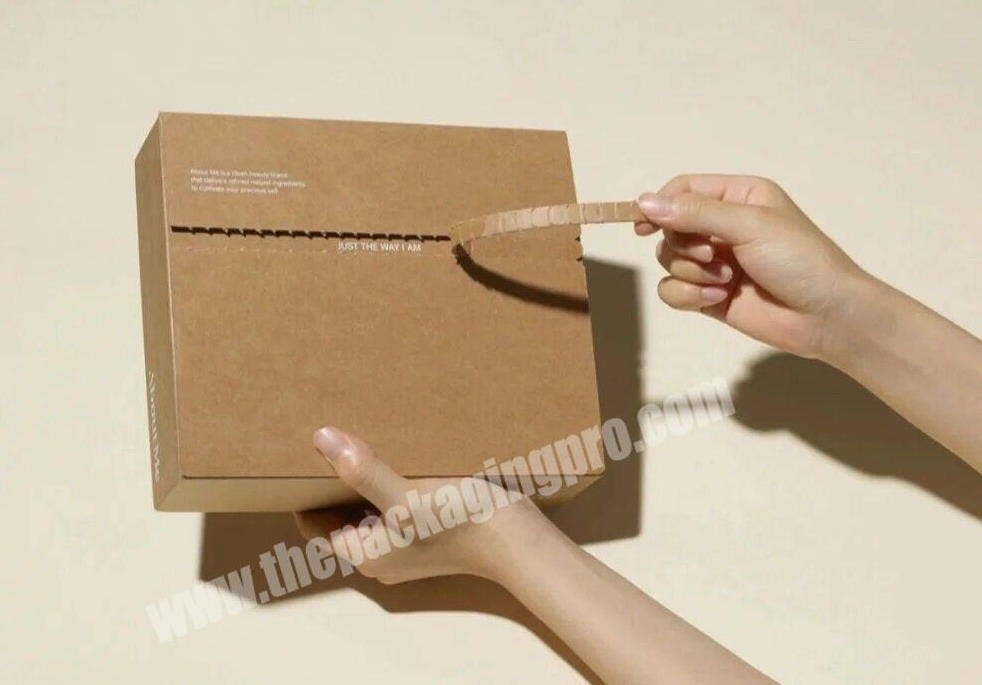 A "tear open" box being torn open by a hand model.