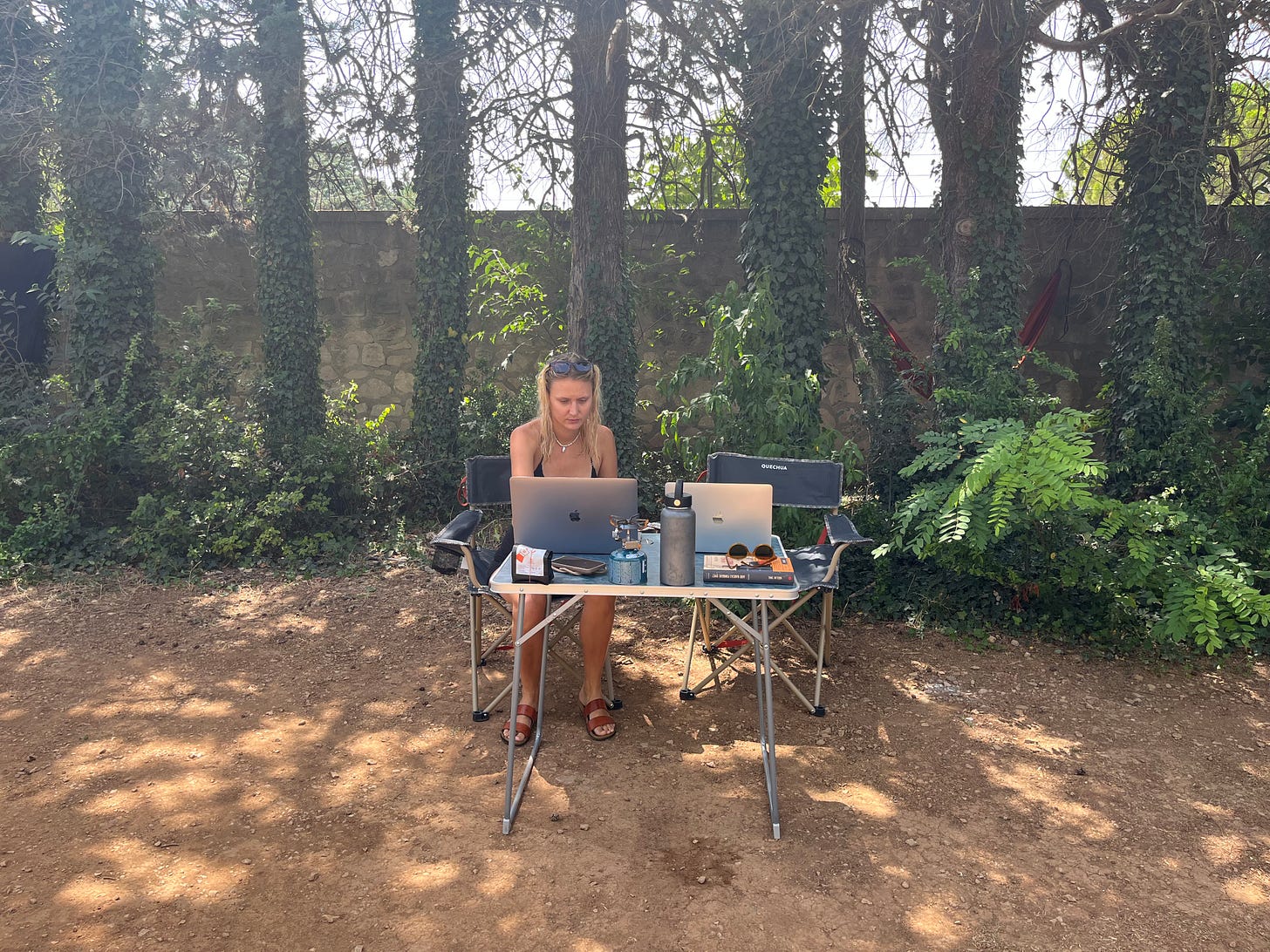 Working on computer in a campground. 