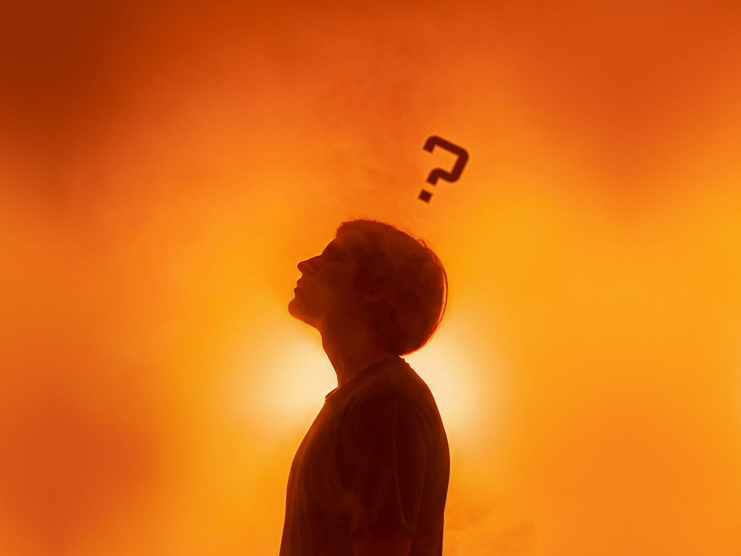 Person looking up with a question mark above their head, in the middle of an orange foggy environment