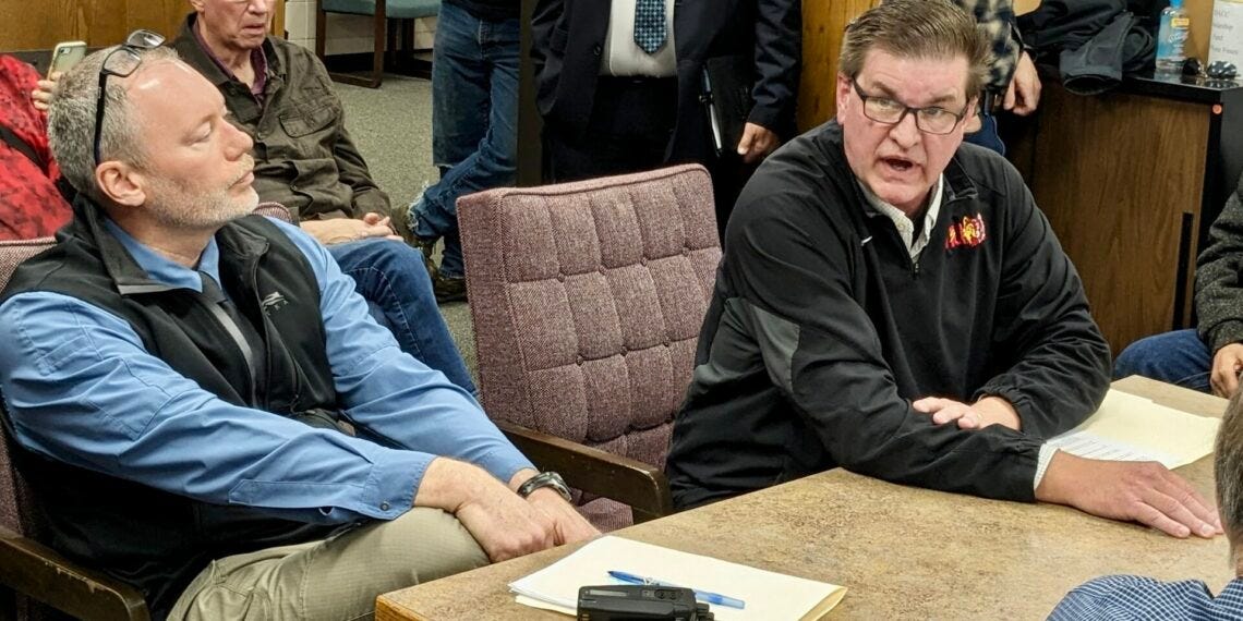 Dave McNeil, chief of the Aberdeen Police Department, left, and Brown County Sheriff Dave Lunzman visit with the Brown County Commission during the Tuesday, April 30 meeting at the courthouse annex. Aberdeen Insider photo by Scott Waltman.