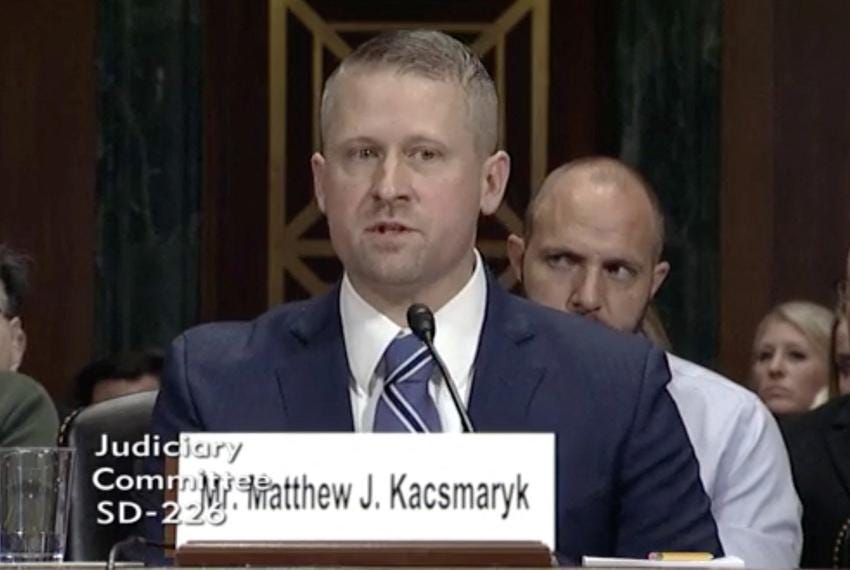 Judge Matthew Kascmaryk testifying, blonde super basic looking guy
