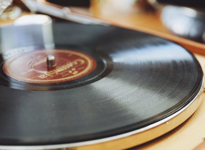 black and gray vinyl disc player