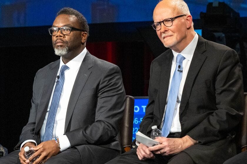 Chicago mayoral candidates Brandon Johnson and Paul Vallas participate in a candidates forum at WTTW studios Feb. 7.
