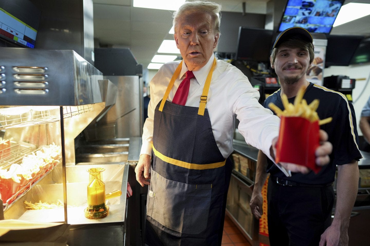 Donald Trump slings French fries during McDonald's stop | Fortune