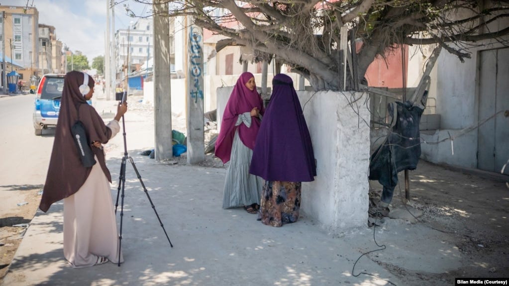 FILE - Journalists from the Somali women-led newsroom Bilan are seen on assignment. (UNDP/2022/Said Fadhaye)