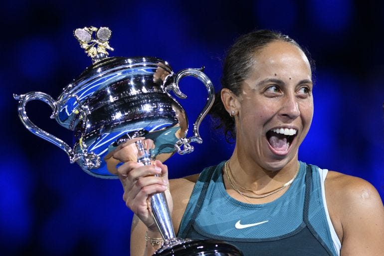 Tennis - Australian Open - Melbourne Park, Melbourne, Australia - January 25, 2025 Madison Keys of the U.S. celebrates with the trophy after winning the final against Belarus' Aryna Sabalenka REUTERS/Jaimi Joy