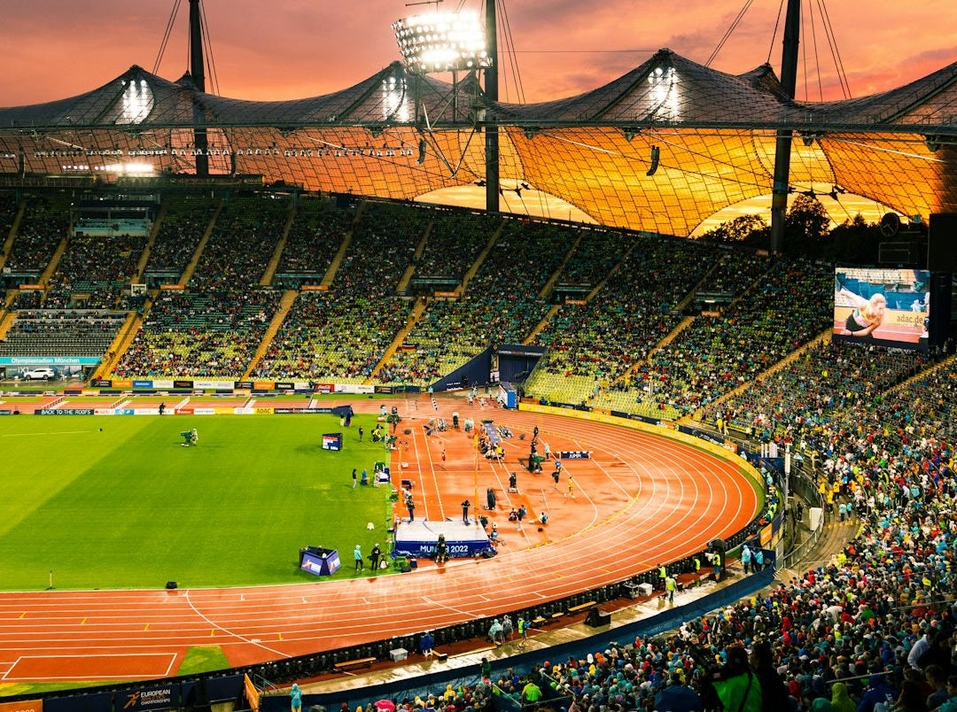 a baseball stadium with a crowd of people in it