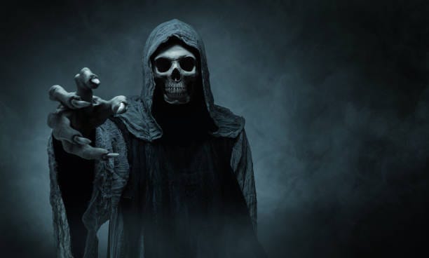 Grim reaper reaching towards the camera Grim reaper reaching towards the camera over dark misty background with copy space scary monsters stock pictures, royalty-free photos & images