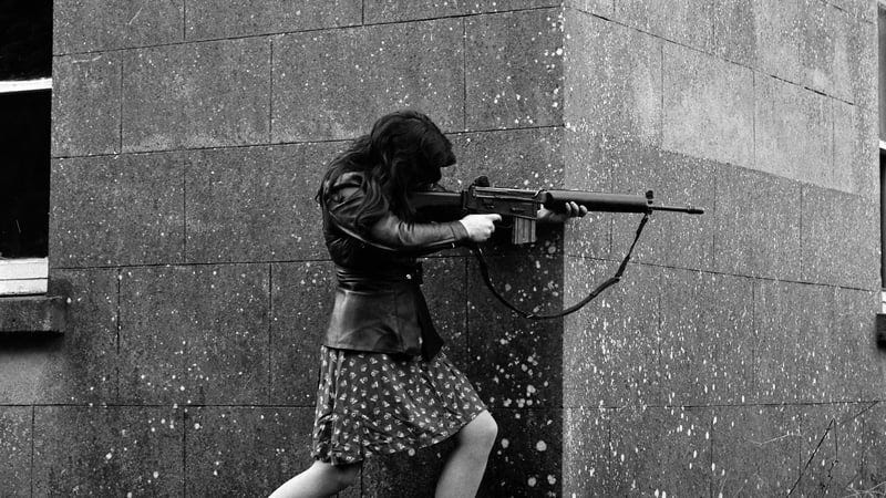 A woman IRA volunteer on active service in west Belfast with an AR18 assault rifle. Photo: Colman Doyle Collection/National Library of Ireland