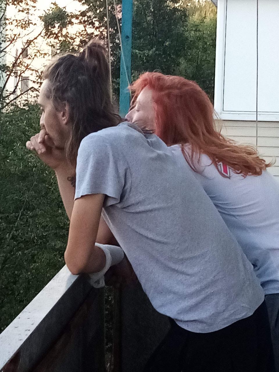 Lilia Sudakova and Sergei Popov on a balcony