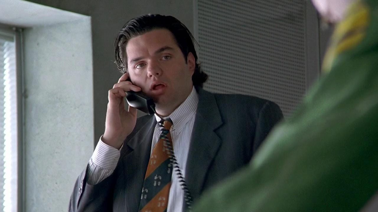 Oliver Platt talking on a corded telephone from the movie Indecent Proposal.