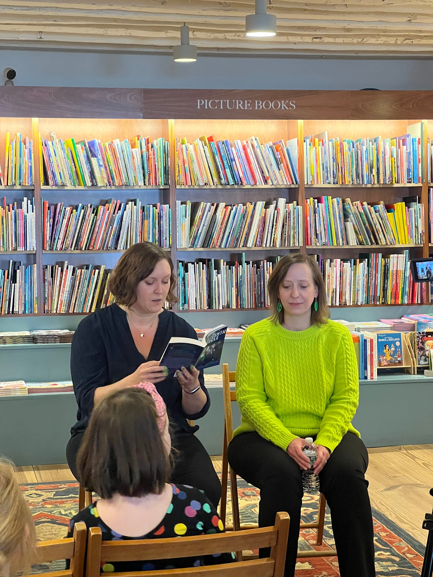 Kathryn reading from The Thirteenth Circle, MarcyKate sitting beside her, at the launch event at McNally Jackson in NYC
