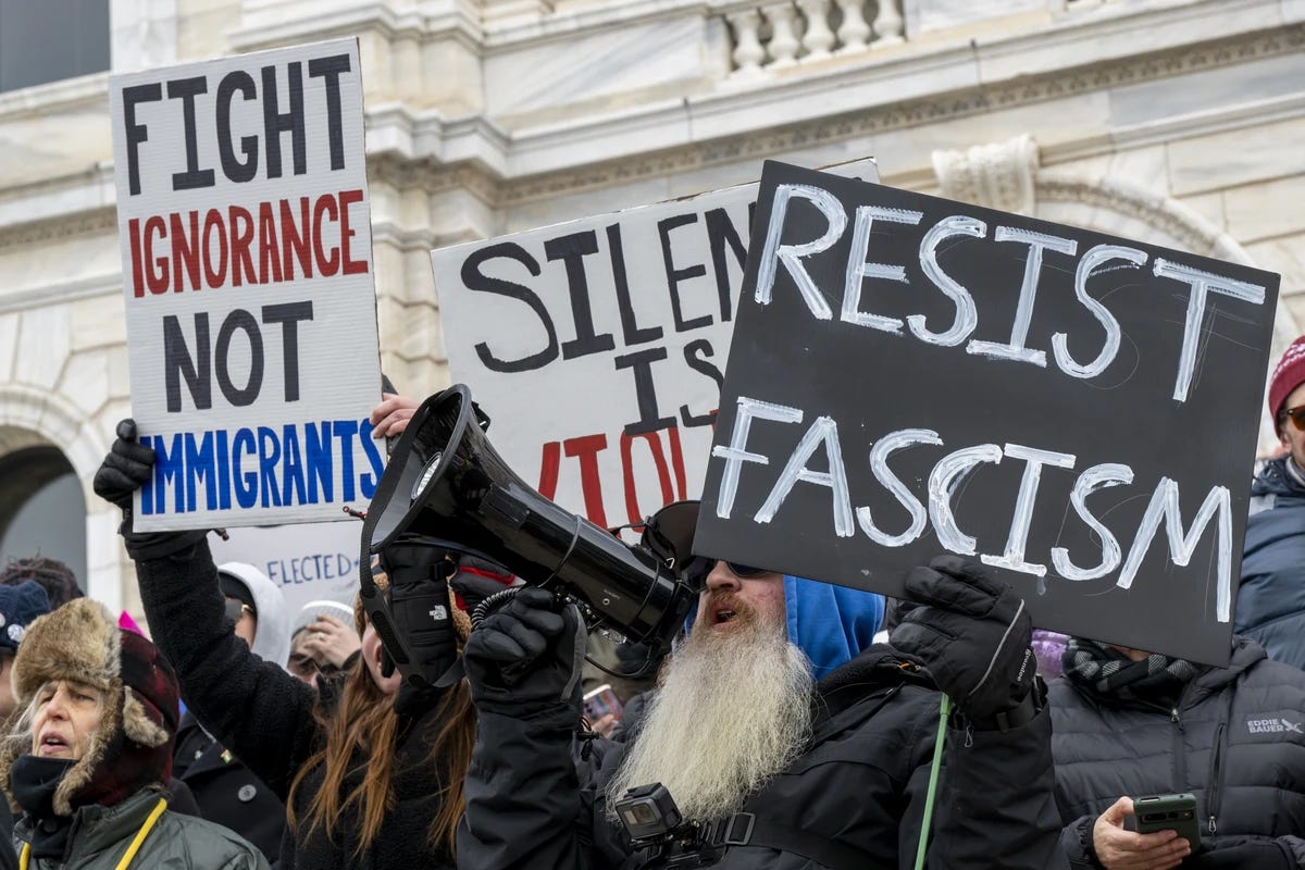 This photo, taken by Michael Siluk of the UCG/Universal Images Group, shows protestors rallying outside the Minnesota State Capitol in St. Paul, Minnesota on 5 February 2025. The 50501 Movement organized this nationwide protest of Donald Trump's presidential regime. Two protest signs are clearly visible: 1) On the left, a sign bearing the words "Fight Ignorance Not Immigrants" and 2) On the right, a sign bearing the words "Resist Fascism." This photo, taken by Michael Siluk of the UCG/Universal Images Group, shows protestors rallying outside the Minnesota State Capitol in St. Paul, Minnesota on 5 February 2025. The 50501 Movement organized this nationwide protest of Donald Trump's presidential regime. Two protest signs are clearly visible: 1) On the left, a sign bearing the words "Fight Ignorance Not Immigrants" and 2) On the right, a sign bearing the words "Resist Fascism."