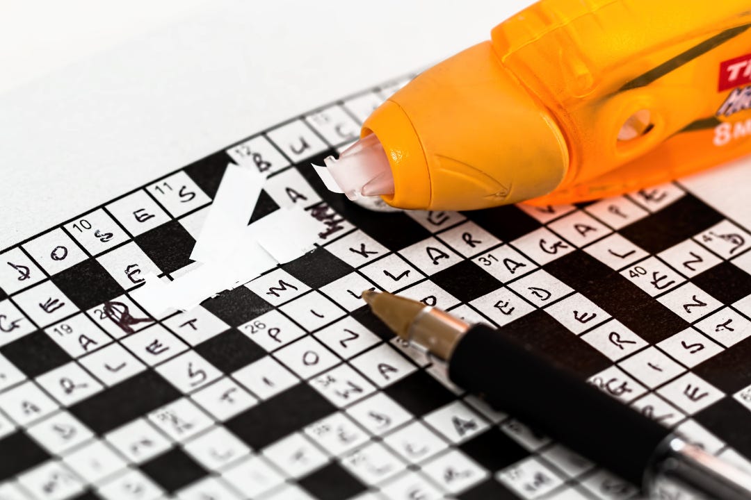 using correction tape to fix a mistake in a crossword