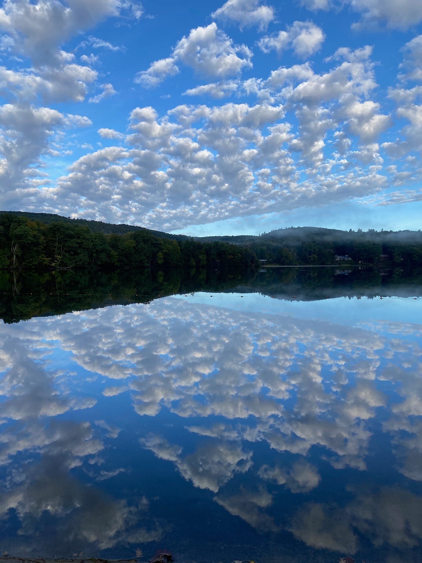 Ashfield Lake with a spectacular reflection of clouds on its still water.