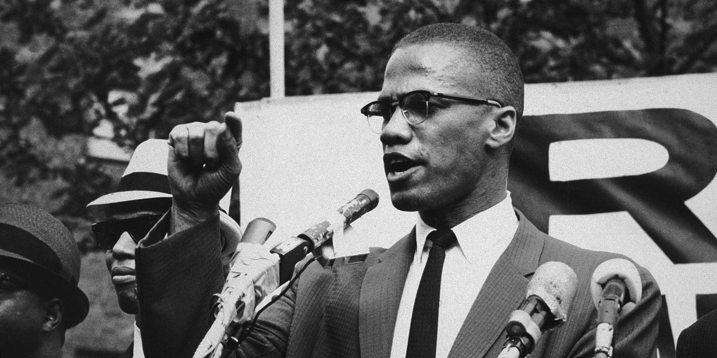 circa 1963: American civil rights leader Malcolm X (1925 - 1965) at an outdoor rally, probably in New York City. (Photo by Bob Parent/Hulton Archive/Getty Images)