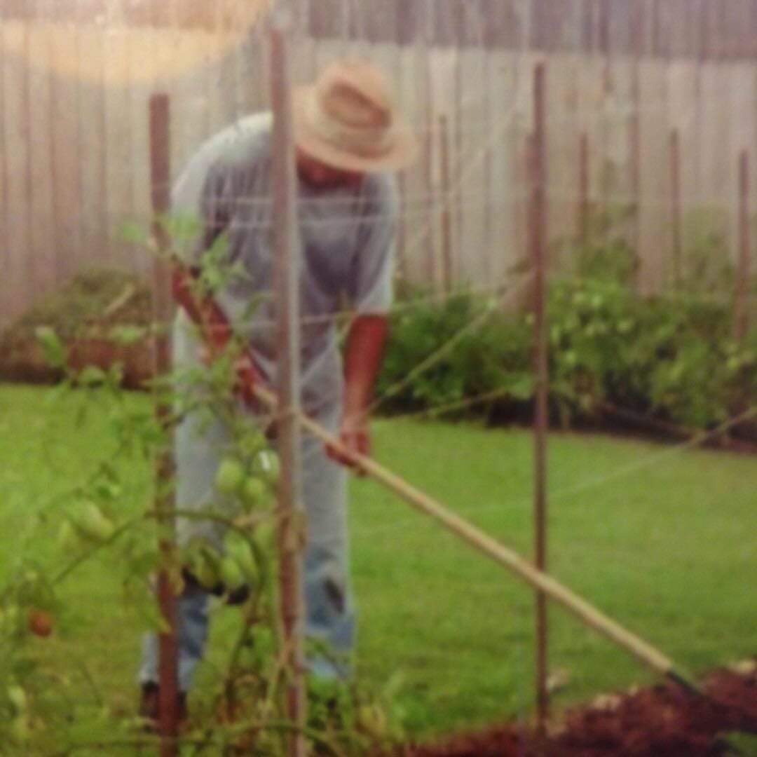 My father tending to his tomatoes. He passed away on Earth Day. 1935-2006