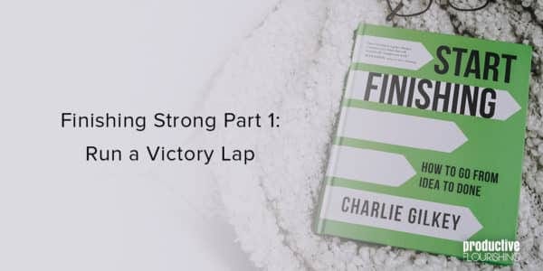 Start Finishing on a fuzzy blanket. Text overlay: Finishing Strong Part 1: Run a Victory Lap