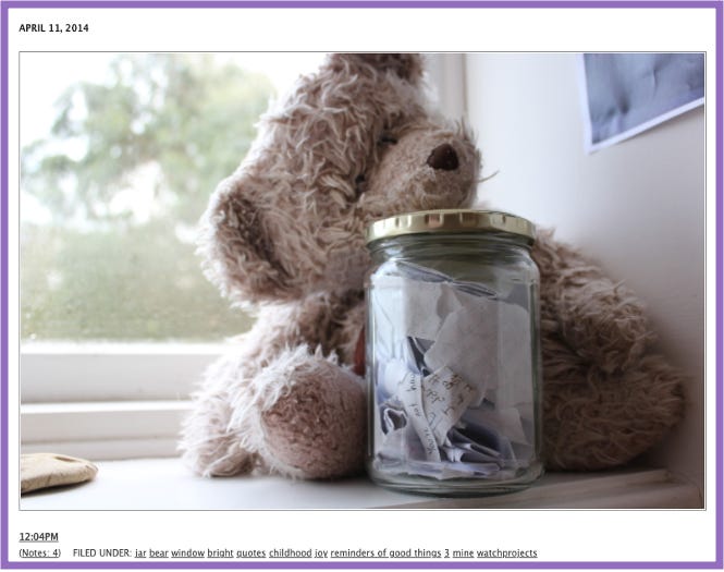 Ursula's Tumblr | Photo of an well-loved teddy bear, leaning against a jar filled with pieces of paper. In the window behind, greenery can be seen. | Tagged #childhood #joy #reminders of good things