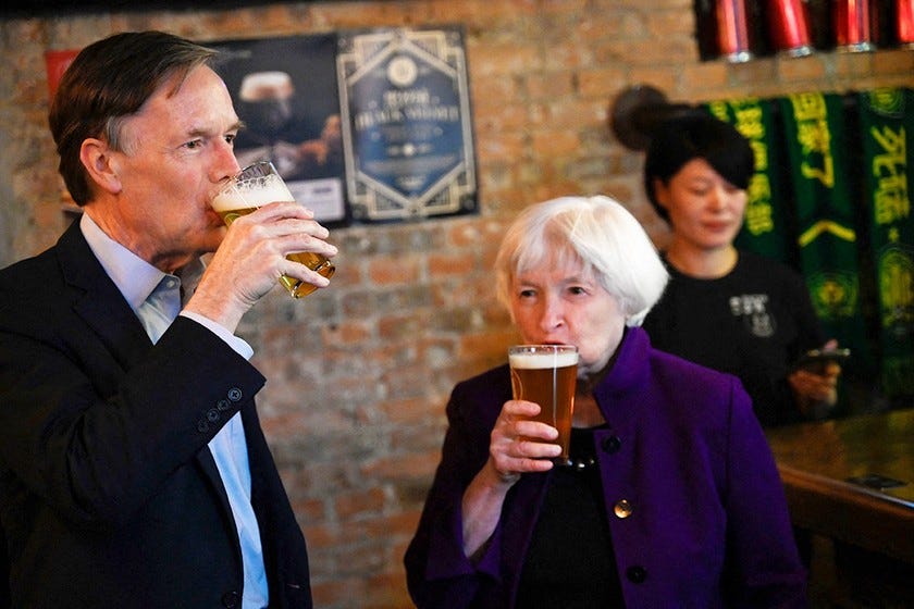 US Treasury secretary Janet Yellen tastes a glass of beer with US Ambassador to China Nicholas Burns at Jing-A Brewing Co in Beijing on Monday.