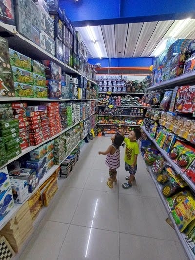 Little kids at the toy section of Massway Supermarket